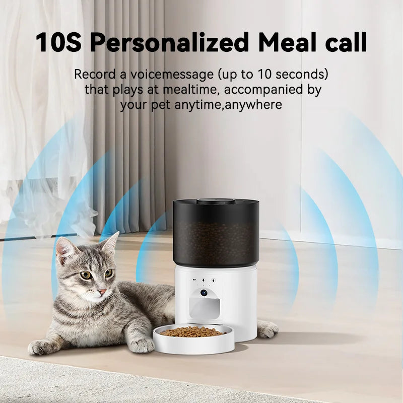 Snugll automatic dog feeder with camera beside a cat and food bowl in a living room setting