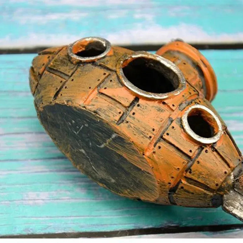 Snugll aquascaping submarine accessory in rustic orange and black with circular openings for aquarium decoration