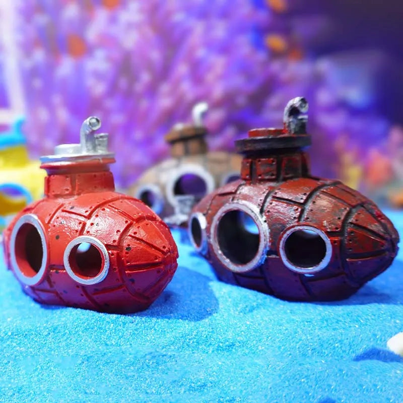 Snugll aquascaping submarine accessory with red and brown miniature submarines on blue sand