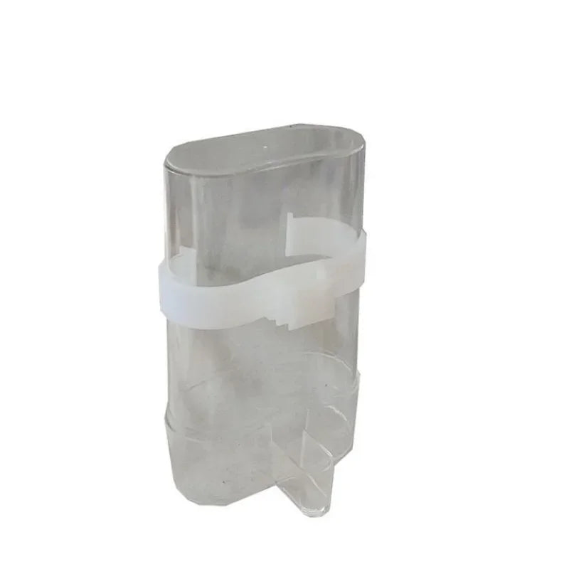 Clear plastic bird feeder attachment for automatic bird feeder with white mounting strap