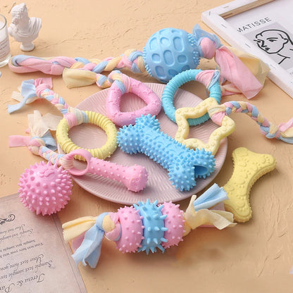 Snugll pets durable dog chew toys in various shapes and pastel colors with textured surfaces