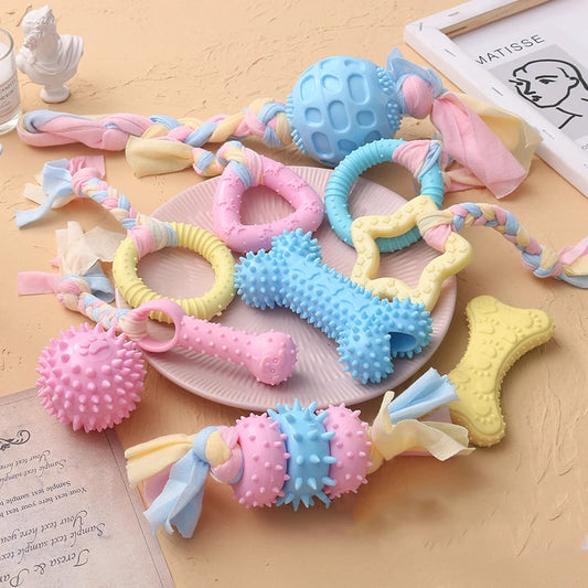 Snugll pets durable dog chew toys in various shapes and pastel colors with textured surfaces