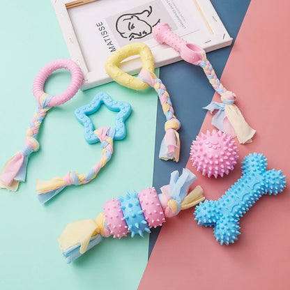 Snugll pets durable dog chew toys in pastel colors with various shapes and textured surfaces for strong chewers