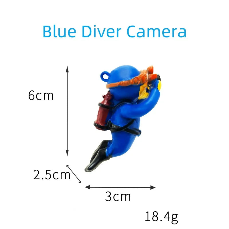 Floating blue diver aquarium decor shaped as a small diver with camera measuring 6cm by 3cm