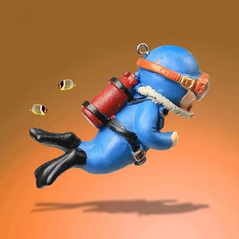 Snugll floating blue diver aquarium decor with red oxygen tank and black flippers