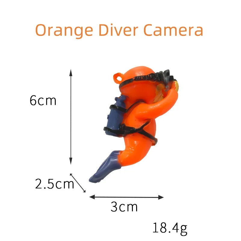 Floating blue diver aquarium decor featuring an orange diver figure with camera and scuba gear