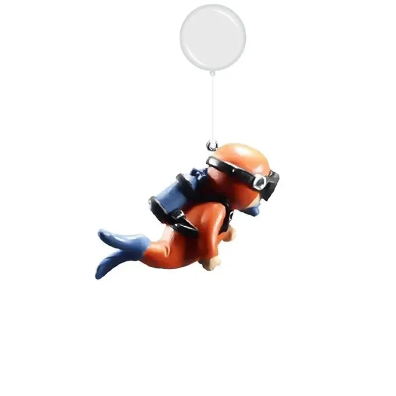 Snugll floating blue diver aquarium decor featuring an orange diver with blue fins and scuba gear