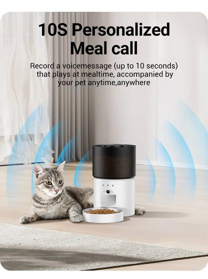 Snugll automatic dog feeder with camera showing 10-second personalized meal call feature near a cat
