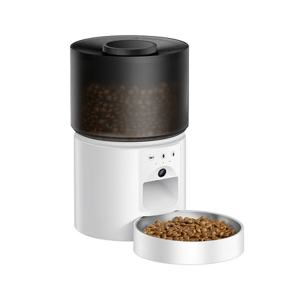 Snugll automatic dog feeder with camera in white and black with dry dog food in bowl