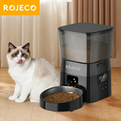 ROJECO timed dog feeder with portion control dispensing dry dog food bowl with cat nearby