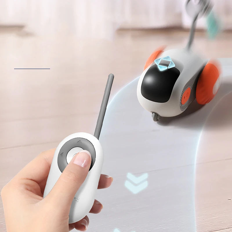 Snugll pets remote controlled pet toy for cats with white handheld controller and rolling toy with orange wheels